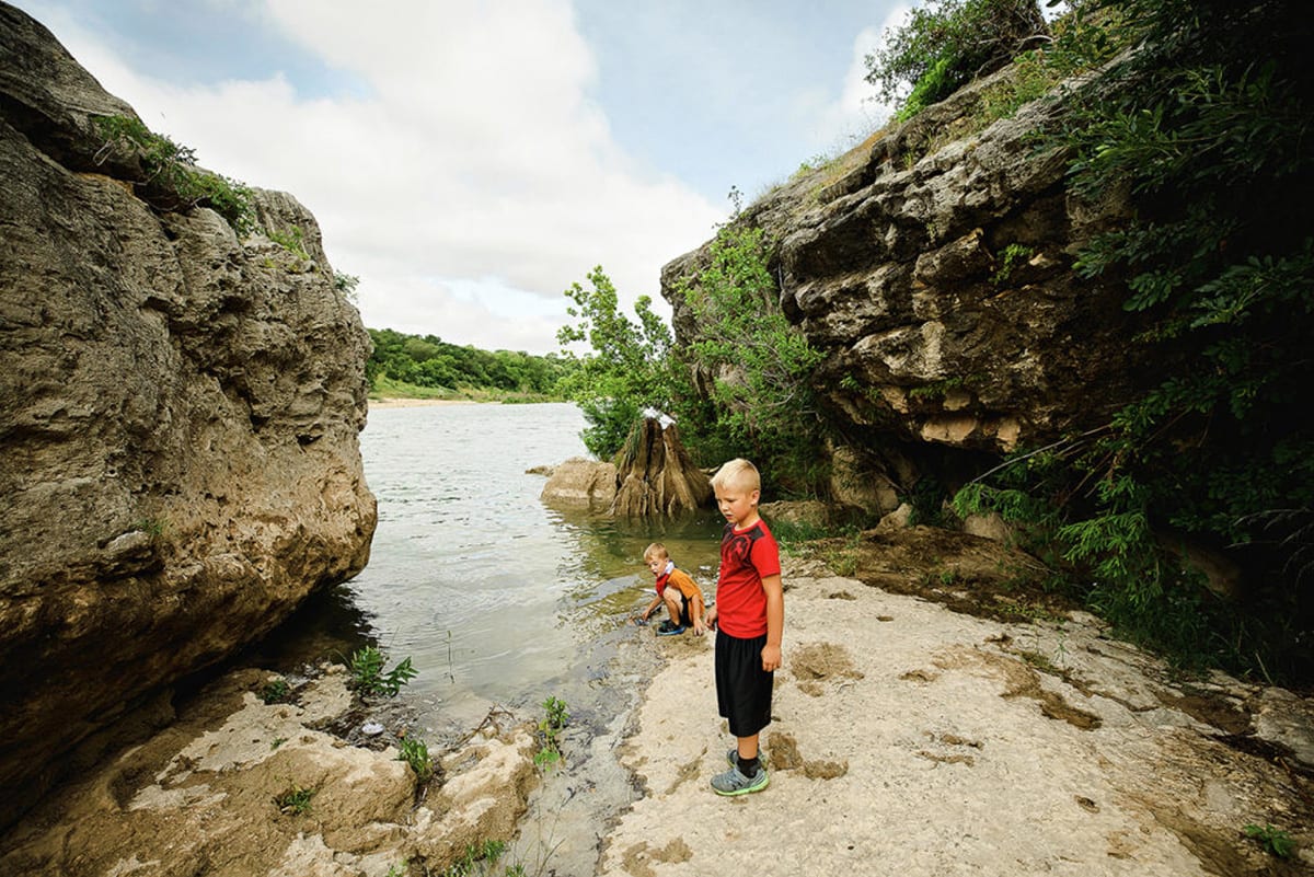 Kids at river at Climber's Canyon trail at Milton Reimer's Ranch in Dripping Springs