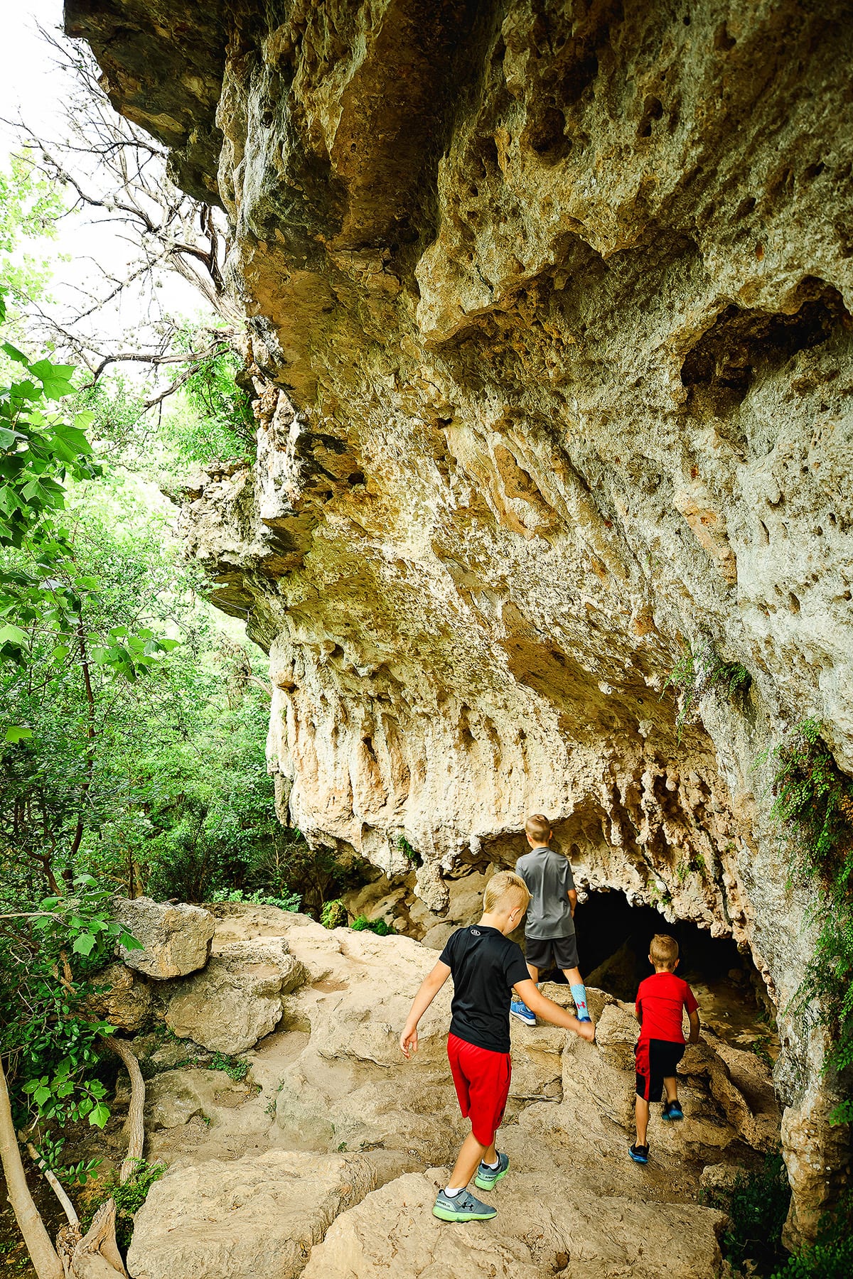 Kids hiking at Climber's Canyon trail at Milton Reimer's Ranch in Dripping Springs