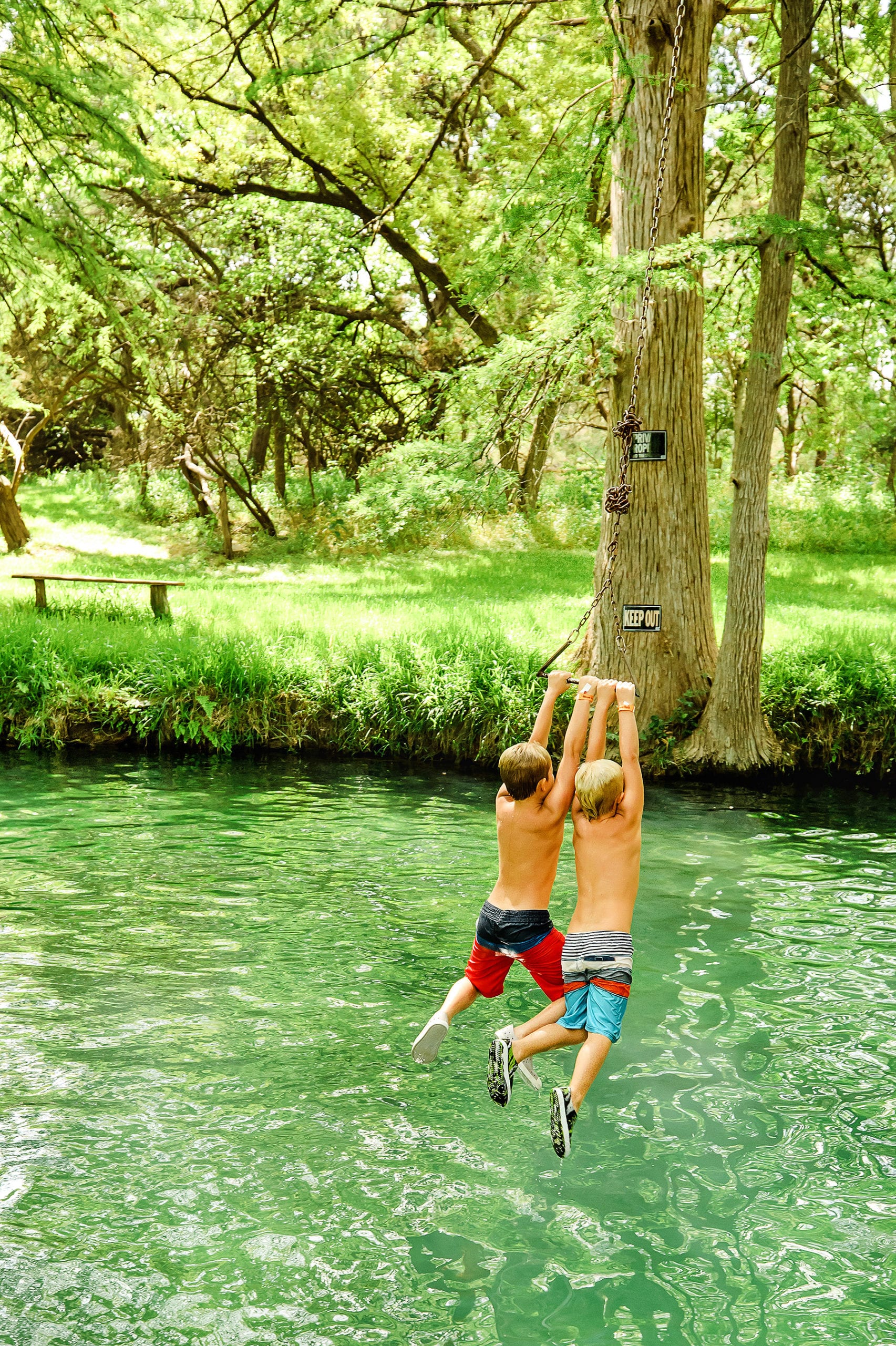 kids swimming  at Blue Hole Wimberley, Texas