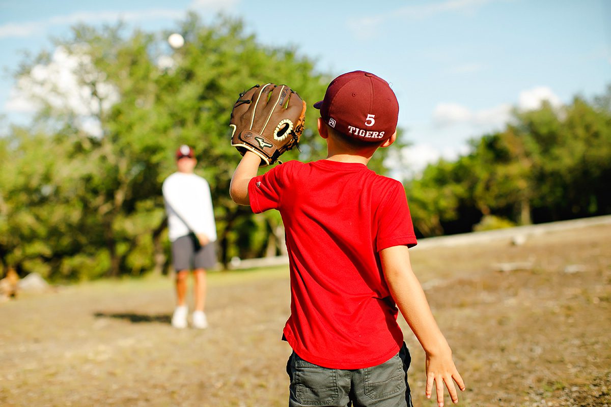 Josh Wright playing baseball with son in Dripping Springs