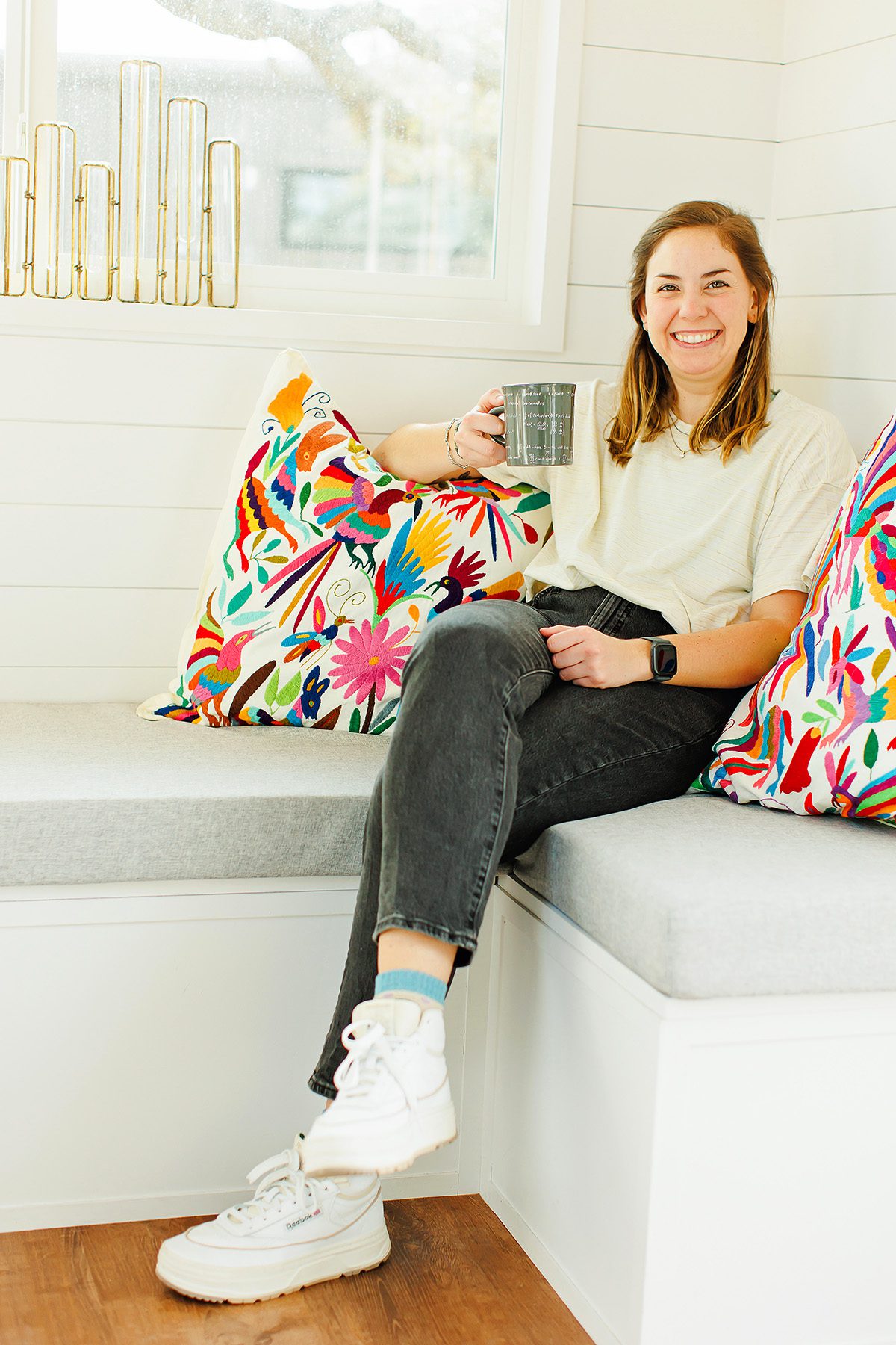 Emily Weyand, Dripping Springs High School math teacher, drinking coffee in her tiny house