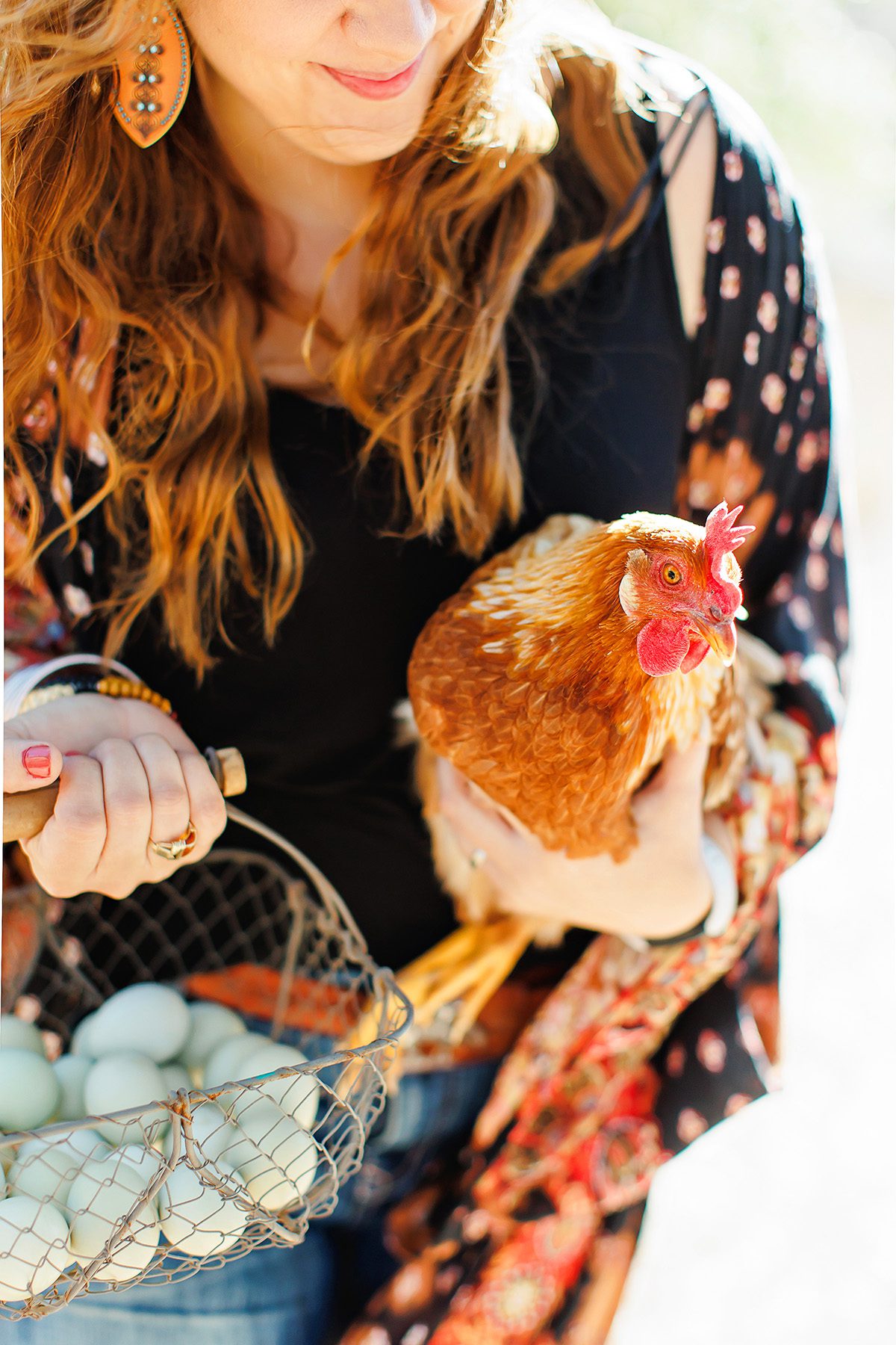 Marla Barnard with chicken on Wanderin Star Farms in Dripping Springs, Texas