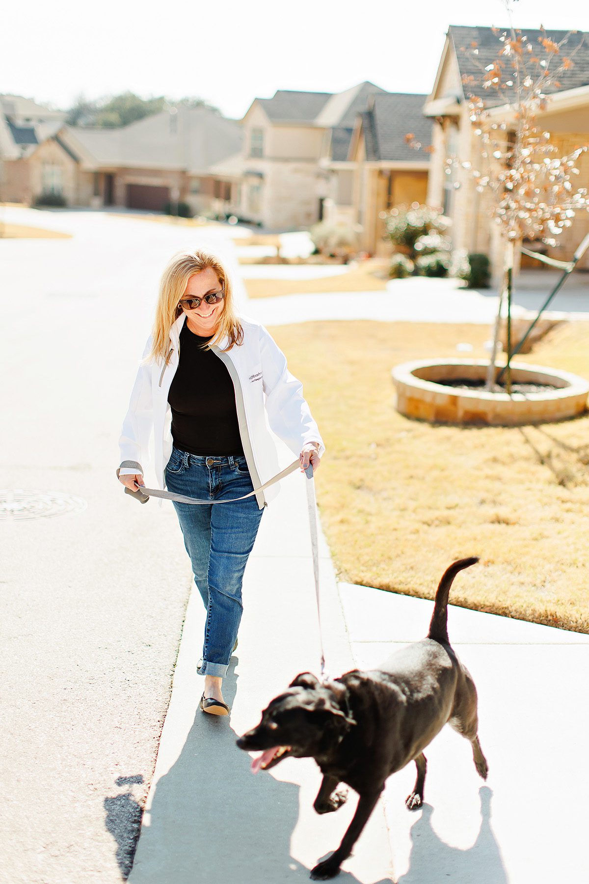 Fawn Crosby Dripping Springs lender with Neighborhood Loans walking her dog Clay in Belterra