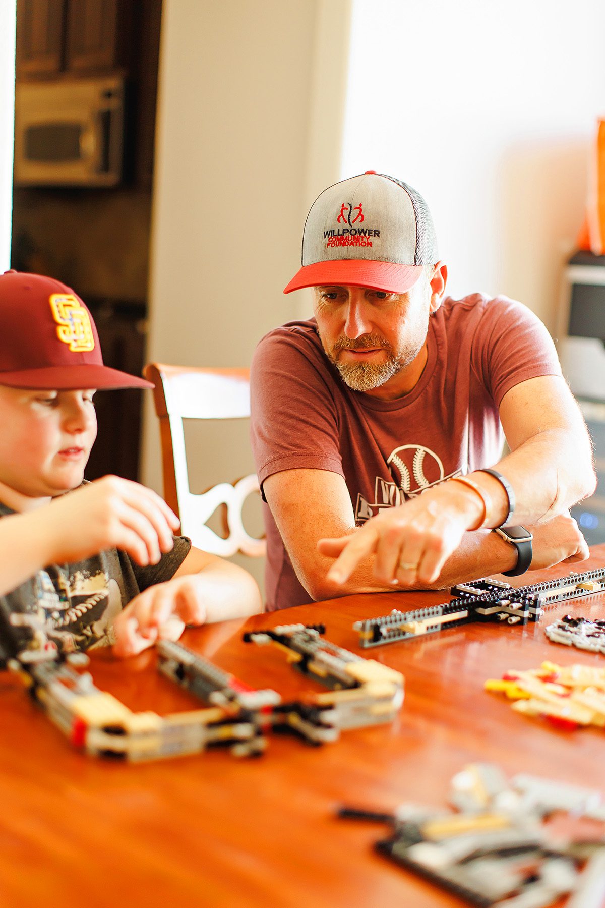 Tim Allen of WillPower baseball playing legos with his son, Will