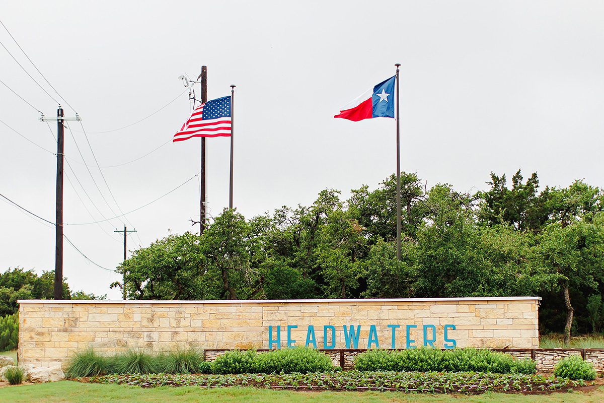 Headwaters sign in Dripping Springs, Texas Lauren Clark Realtor with Magnolia Realty in Dripping Springs
